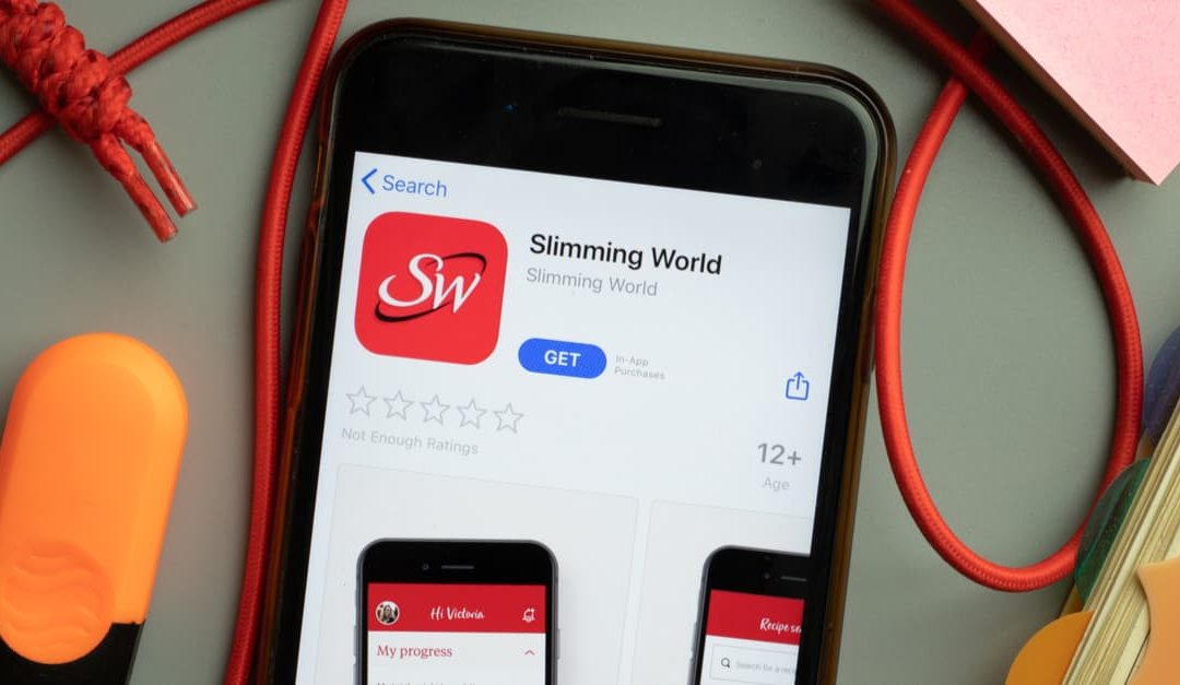 Slimming World app store logo on phone screen