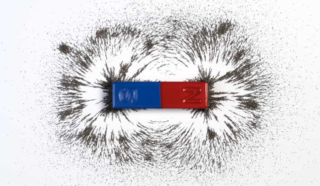Red and blue bar magnet or physics magnetic with iron powder - magnetism effect