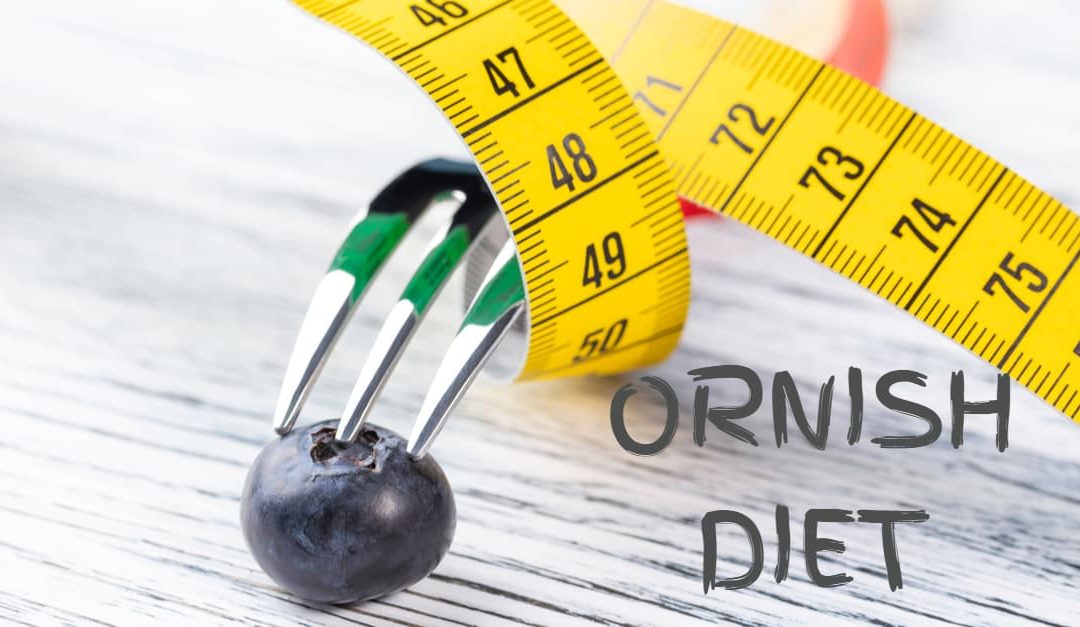 Ornish Diet concept - A dessert fork, wrapped with a yellow measuring tape, stands on a blueberry on a white wooden table