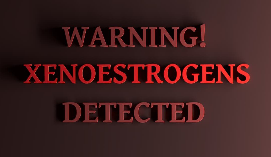 Warning Xenoestrogens Detected written in bold red letters on a dark red background